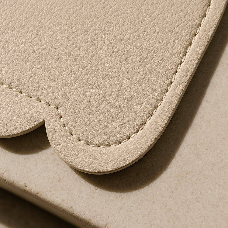 Vegan Leather Changing Mat, Wispy Cream Scallop — primary — Luxury detail / macro — refreshed editorial photography