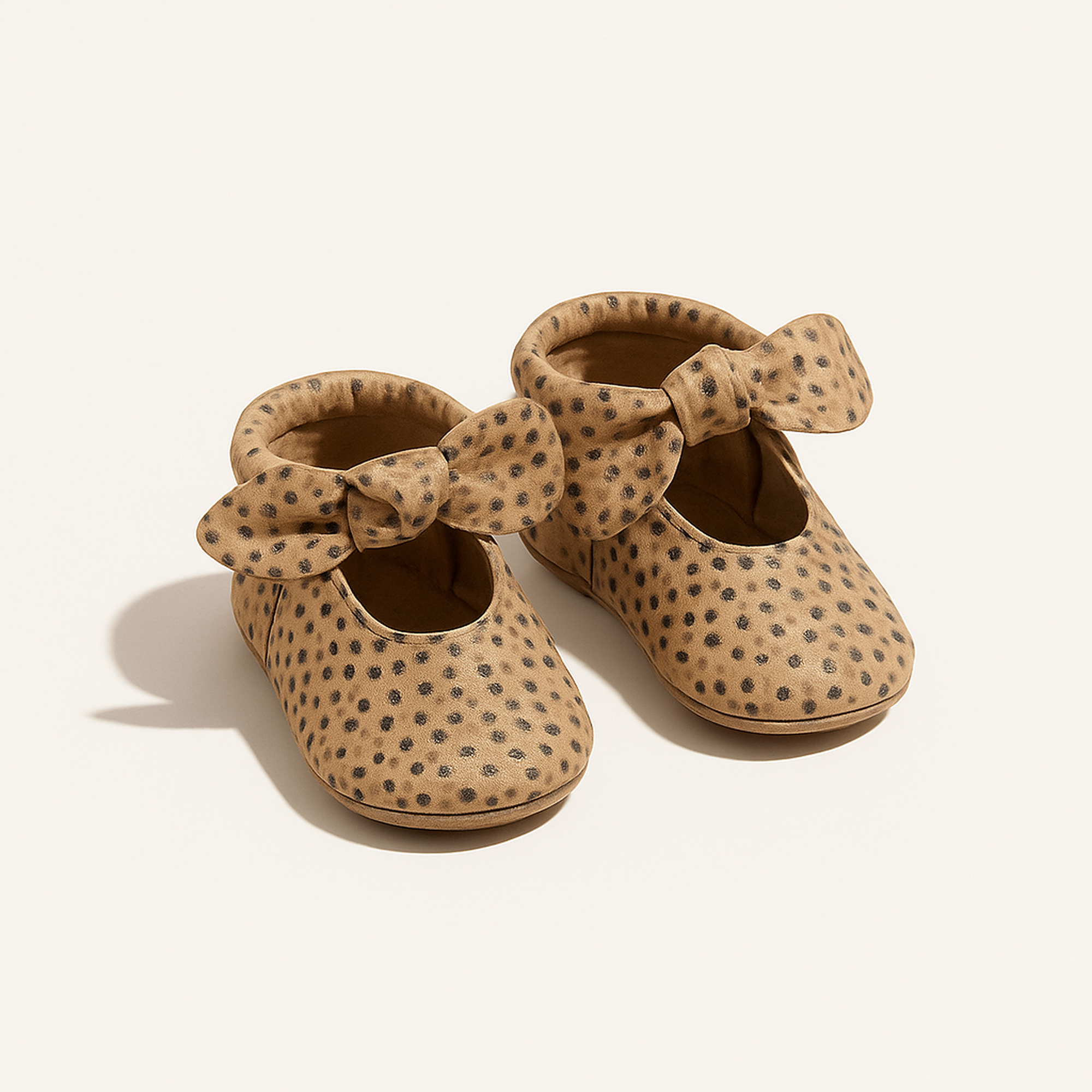 Almond Speckles Knotted Bow Baby Shoe — primary — Clean ecommerce product shot — refreshed editorial photography