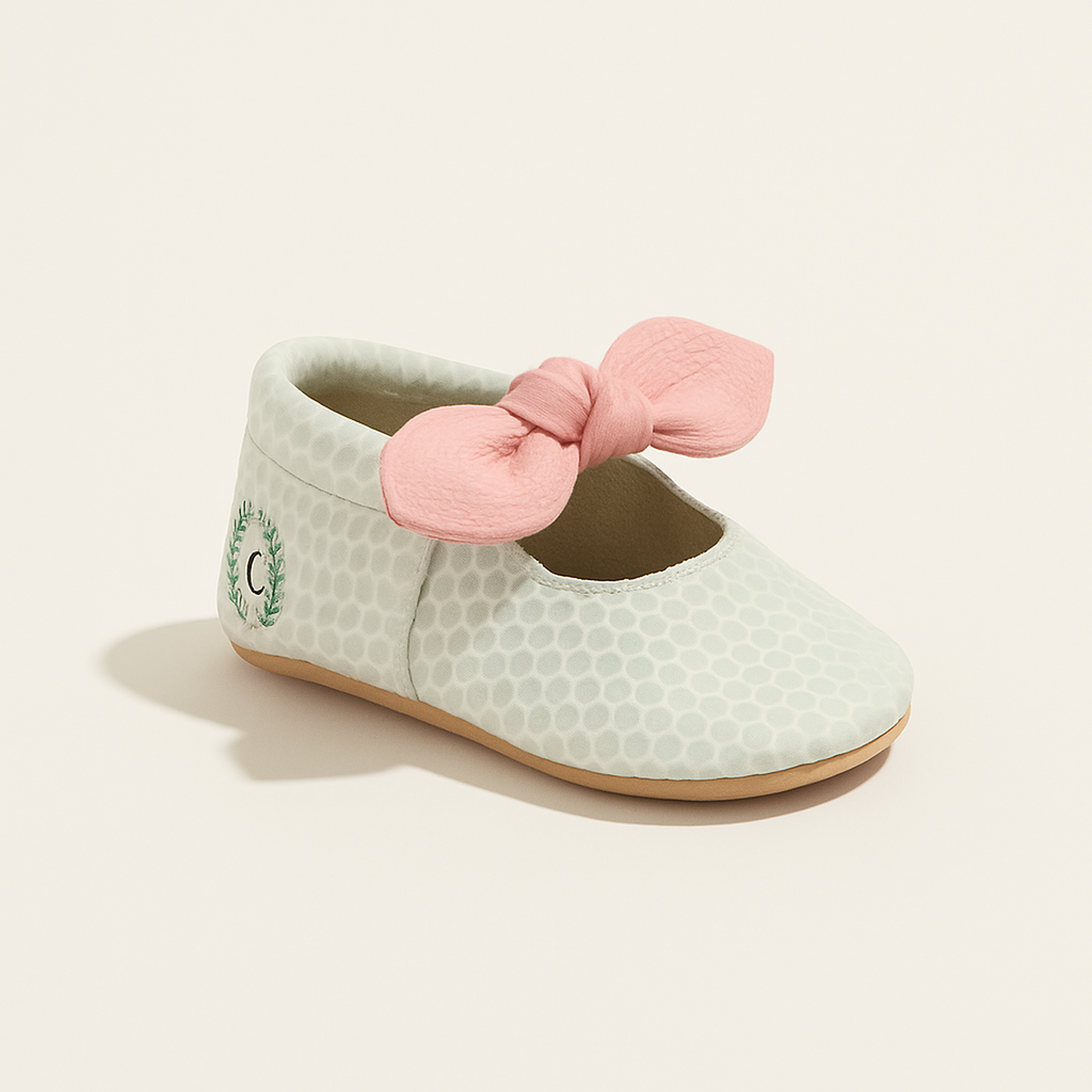 Birdie Knotted Bow Baby Shoe — primary — Clean ecommerce product shot — refreshed editorial photography