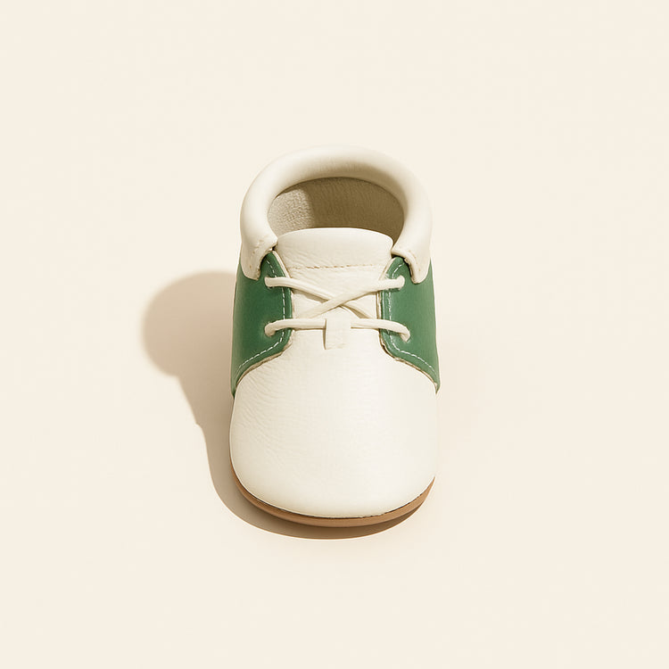 Hole-in-One Oxford Baby Shoe — primary — Clean ecommerce product shot — refreshed editorial photography