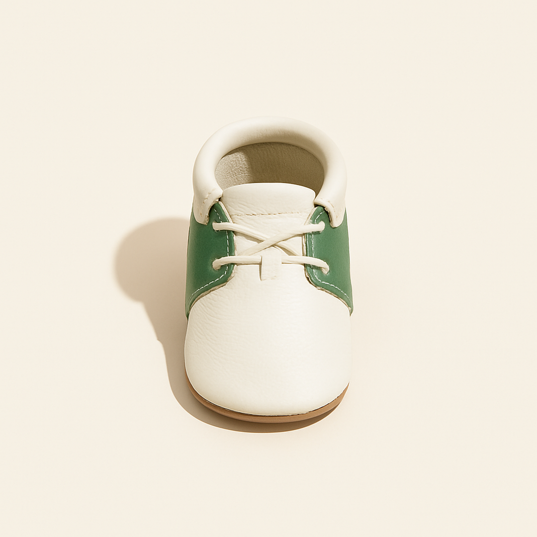 Hole-in-One Oxford Baby Shoe — primary — Clean ecommerce product shot — refreshed editorial photography