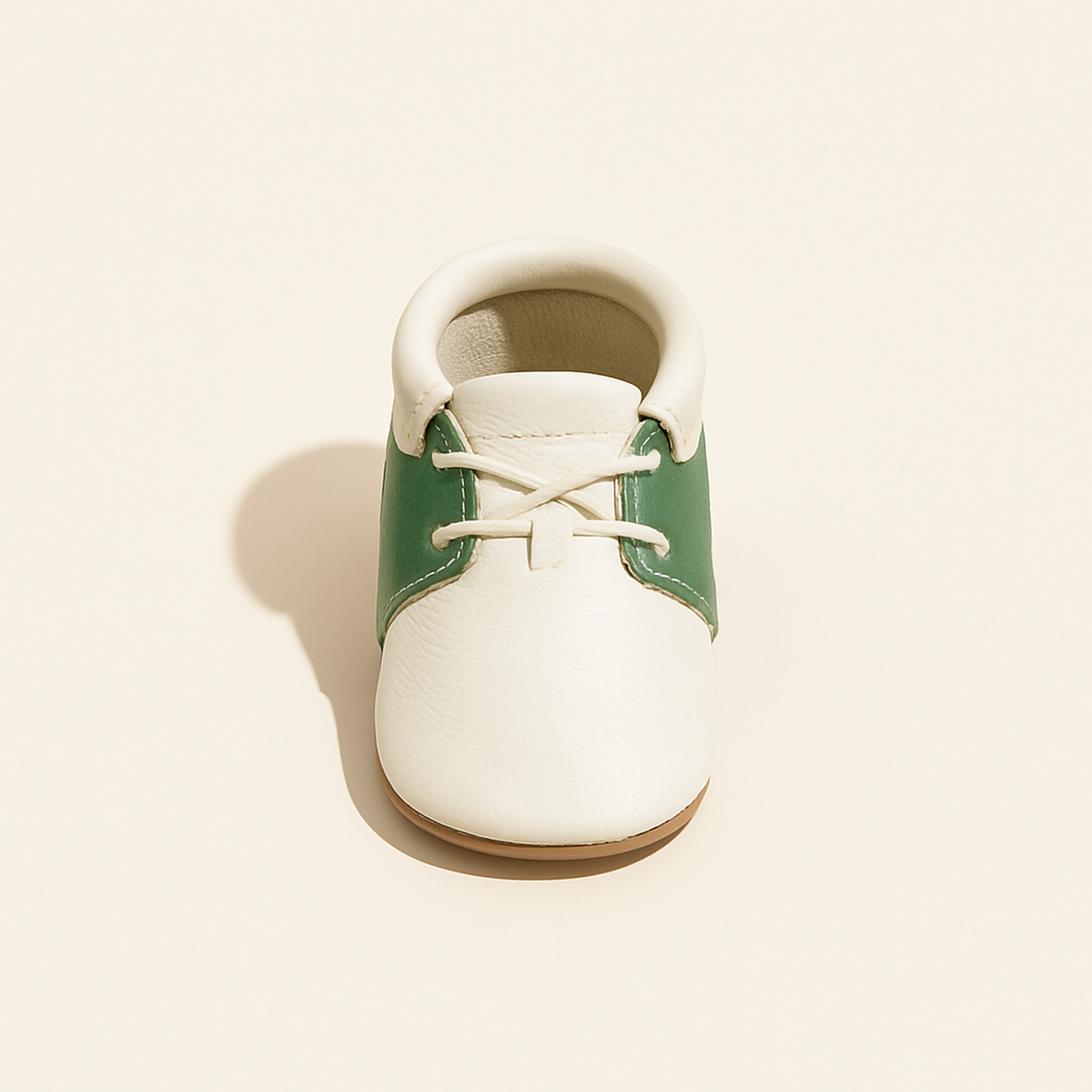 Hole-in-One Oxford Baby Shoe — primary — Clean ecommerce product shot — refreshed editorial photography