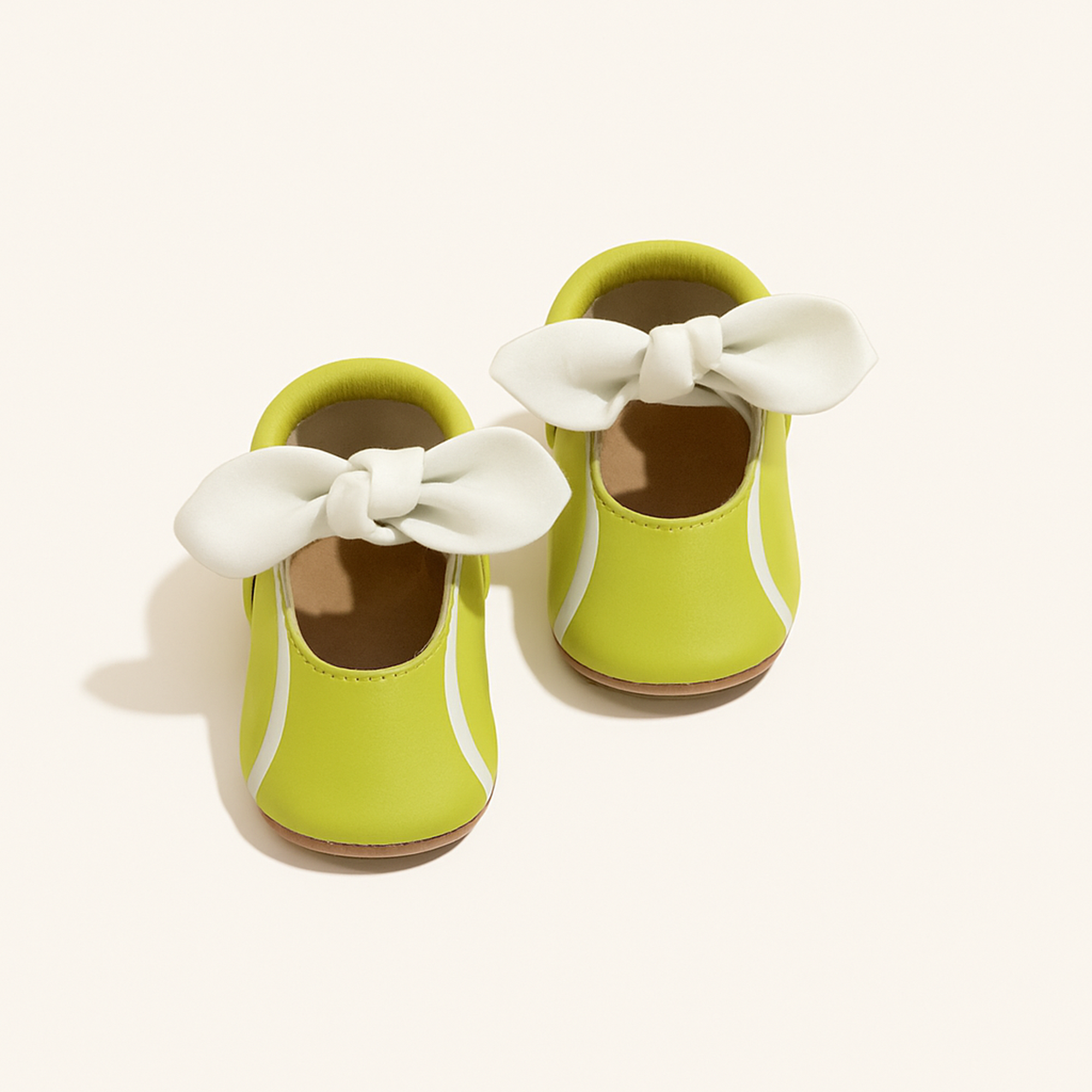 Tennis Match Knotted Bow Baby Shoe — primary — Clean ecommerce product shot — refreshed editorial photography
