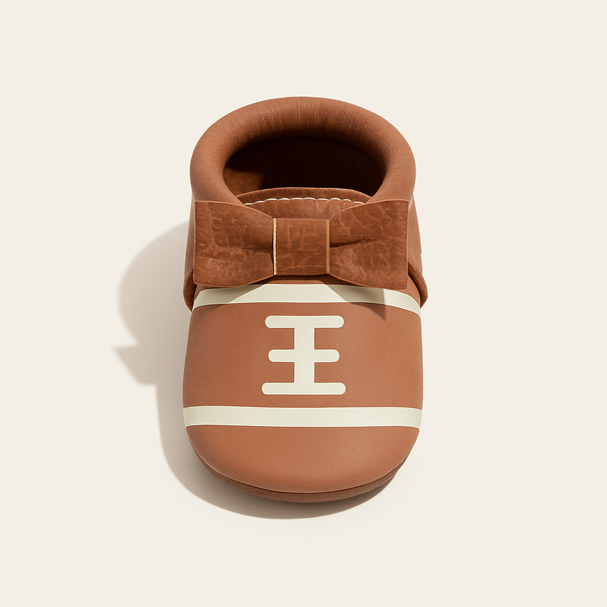 Touchdown II Bow Baby Shoe — primary — Clean ecommerce product shot — refreshed editorial photography